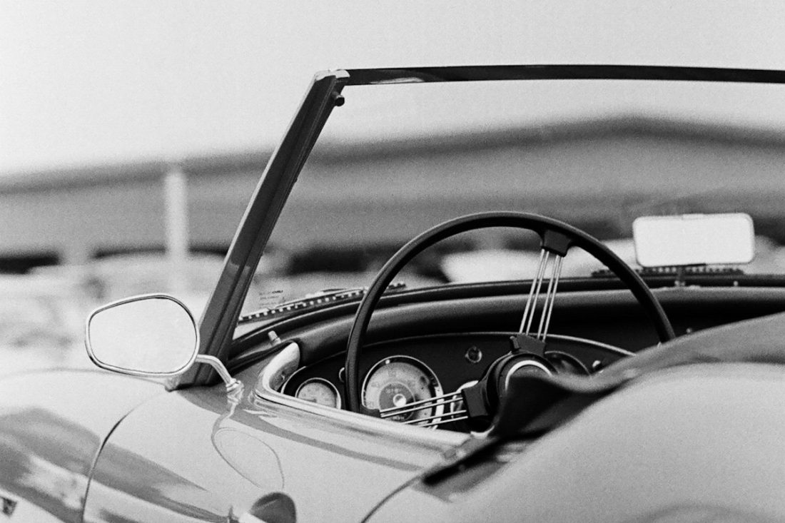 Black and white photo of a classic collector car